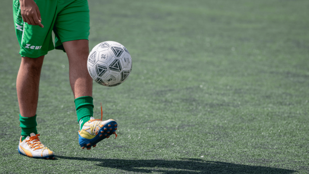 a person kicking a ball