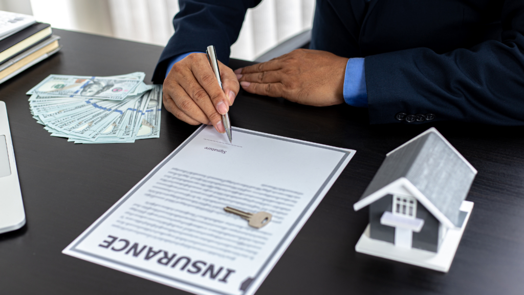 a person signing a mortgage document