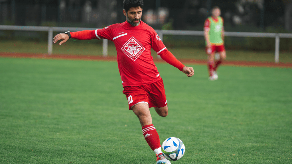 a person kicking a soccer ball