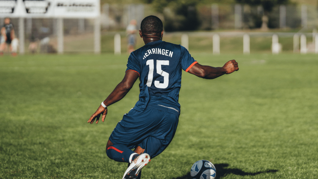 a person kicking a ball