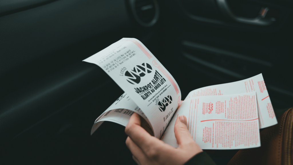 a pile of red tickets with black writing on them