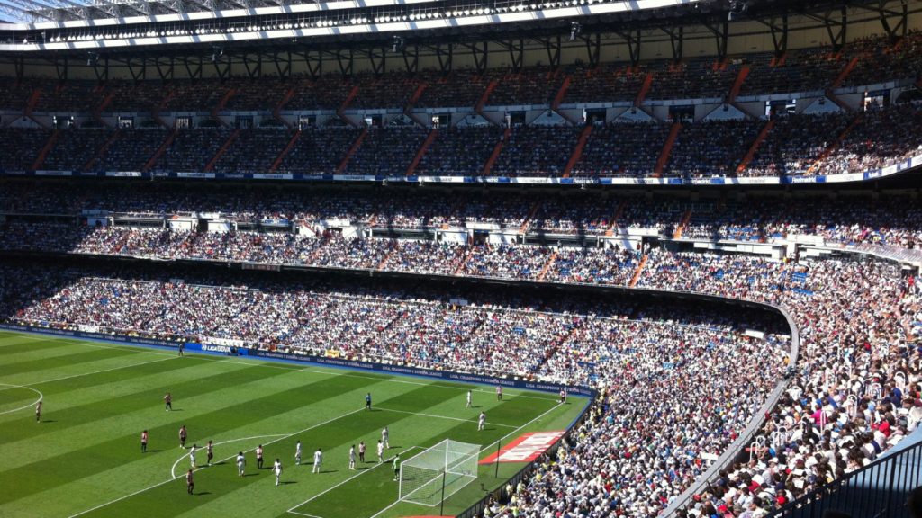 a soccer game is being played in a stadium