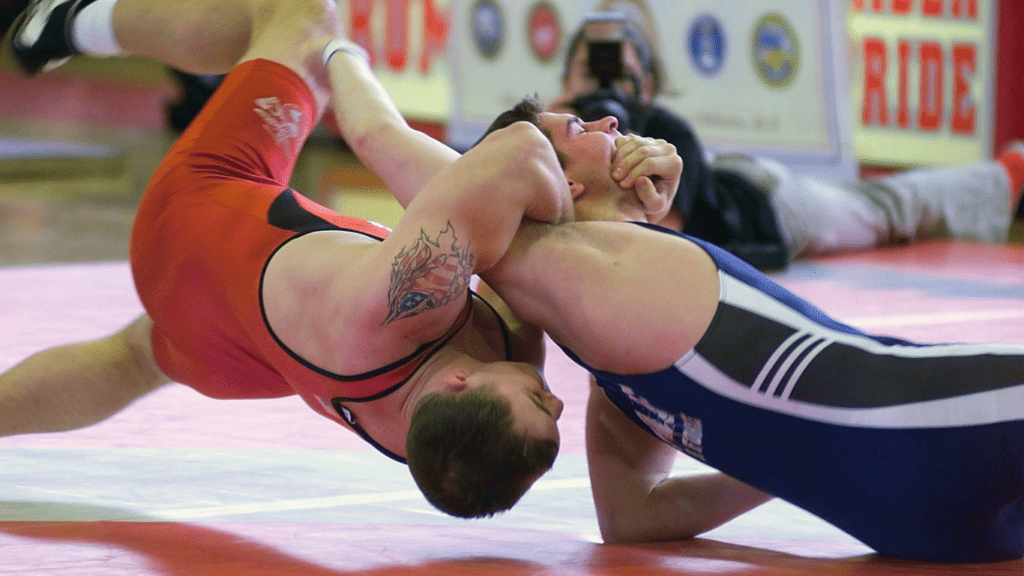 an image of two individuals wrestling in a ring